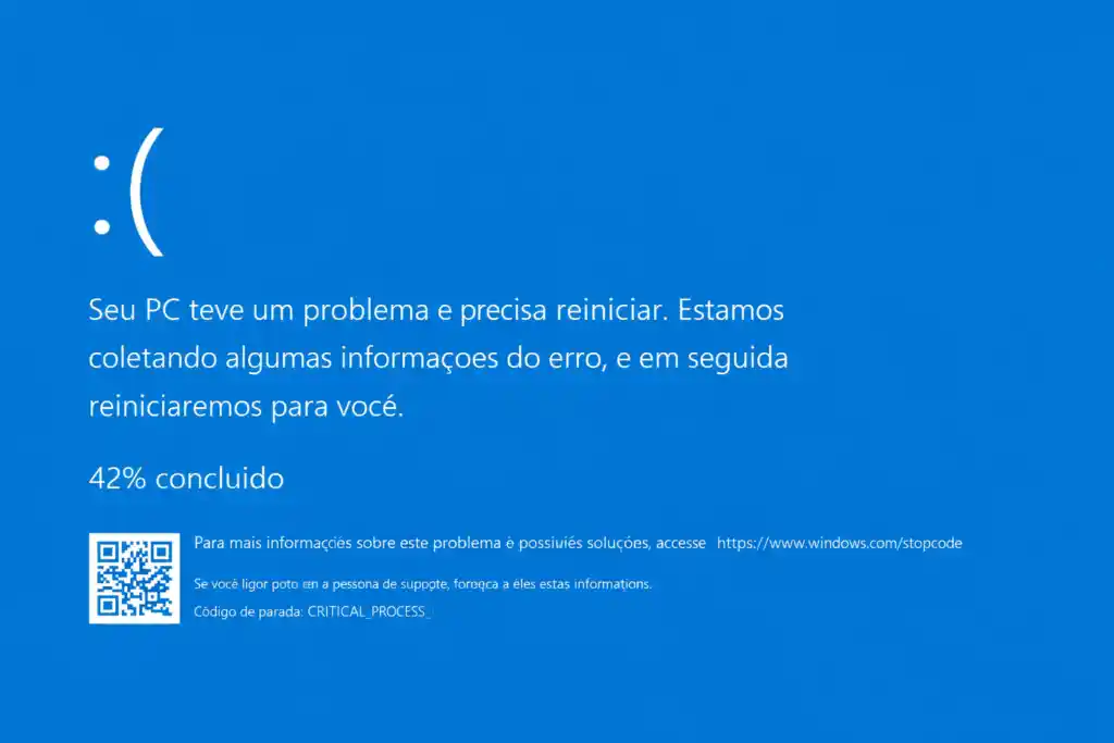 Tela azul de erro do sistema indicando falha crítica no Windows e necessidade de reinicialização do computador